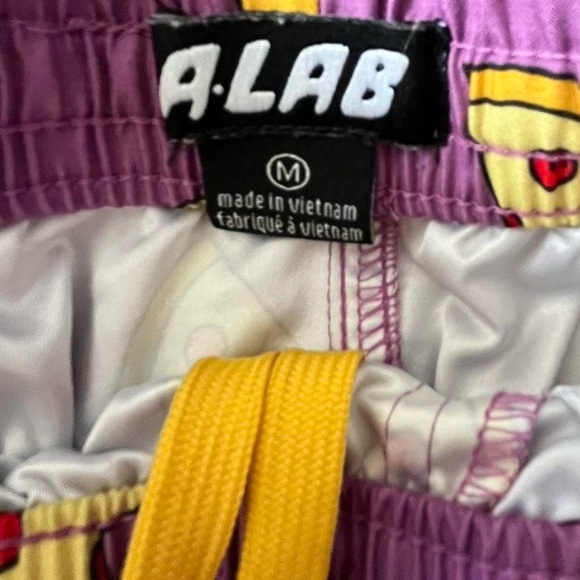 Purple pizza print swim trunks with 3 pockets & secure key loop in back pocket - Picture 4 of 6